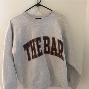 The bar sweatshirt brown letters
